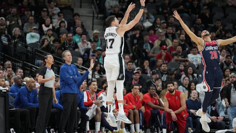 Jan 29, 2024; San Antonio, Texas, USA; San Antonio Spurs forward Doug McDermott (17) shoots over Washington Wizards guard Landry Shamet (20) in the second half at Frost Bank Center. Mandatory Credit: Daniel Dunn-USA TODAY Sports