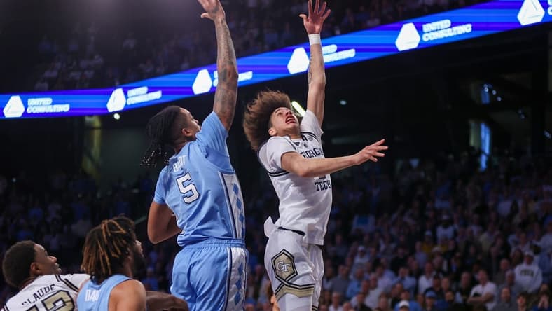 Jan 30, 2024; Atlanta, Georgia, USA; Georgia Tech Yellow Jackets guard Naithan George (2) shoots over North Carolina Tar Heels forward Armando Bacot (5) in the second half at McCamish Pavilion. Mandatory Credit: Brett Davis-USA TODAY Sports