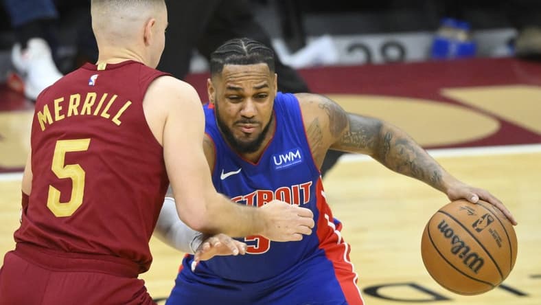 Jan 31, 2024; Cleveland, Ohio, USA; Cleveland Cavaliers guard Sam Merrill (5) defends Detroit Pistons guard Monte Morris (5) in the third quarter at Rocket Mortgage FieldHouse. Mandatory Credit: David Richard-USA TODAY Sports