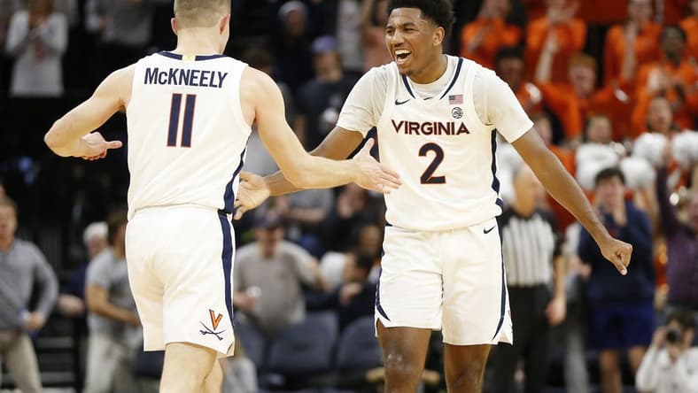 Jan 31, 2024; Charlottesville, Virginia, USA; Virginia Cavaliers guard Isaac McKneely (11) celebrates with Cavaliers guard Reece Beekman (2) after scoring against the Notre Dame Fighting Irish during the first half at John Paul Jones Arena. Mandatory Credit: Amber Searls-USA TODAY Sports