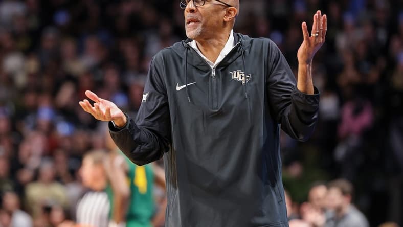 Jan 31, 2024; Orlando, Florida, USA; UCF Knights head coach Johnny Dawkins reacts to a call during the first half against the Baylor Bears at Addition Financial Arena. Mandatory Credit: Mike Watters-USA TODAY Sports