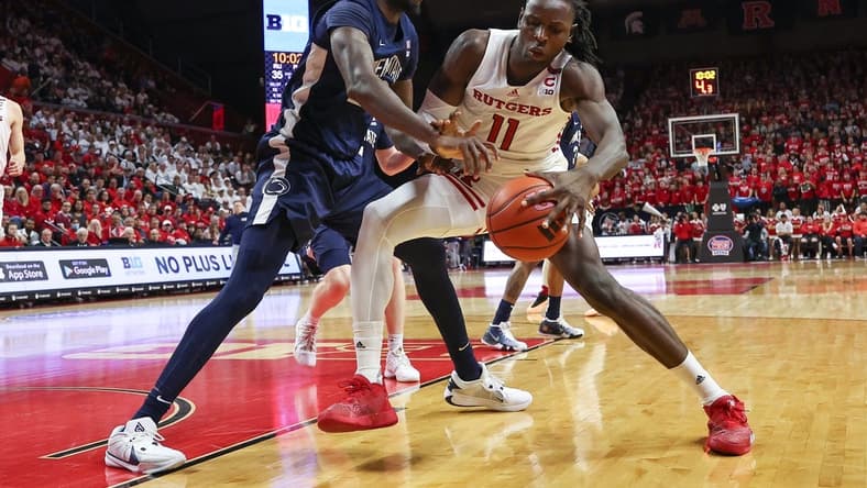 Jan 31, 2024; Piscataway, New Jersey, USA; Rutgers Scarlet Knights center Clifford Omoruyi (11) dribbles against Penn State Nittany Lions forward Qudus Wahab (22) during the second half at Jersey Mike's Arena. Mandatory Credit: Vincent Carchietta-USA TODAY Sports