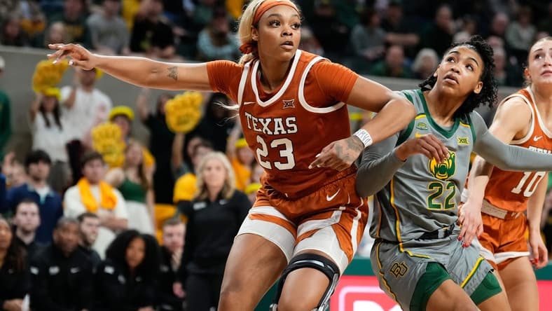Feb 1, 2024; Waco, Texas, USA; Texas Longhorns forward Aaliyah Moore (23) and Baylor Lady Bears guard Bella Fontleroy (22) battle for position during the second half at Paul and Alejandra Foster Pavilion. Mandatory Credit: Chris Jones-USA TODAY Sports