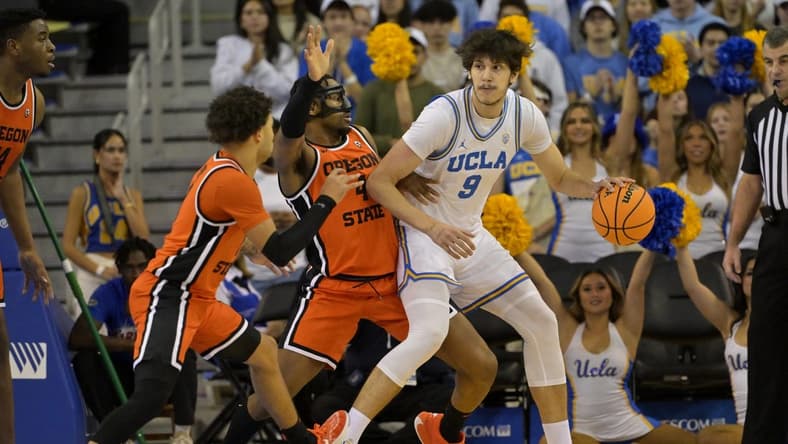 Feb 1, 2024; Los Angeles, California, USA; Oregon State Beavers guard Jordan Pope (0) and guard Dexter Akanno (4) defend UCLA Bruins forward Berke Buyuktuncel (9) in the first half at Pauley Pavilion presented by Wescom. Mandatory Credit: Jayne Kamin-Oncea-USA TODAY Sports