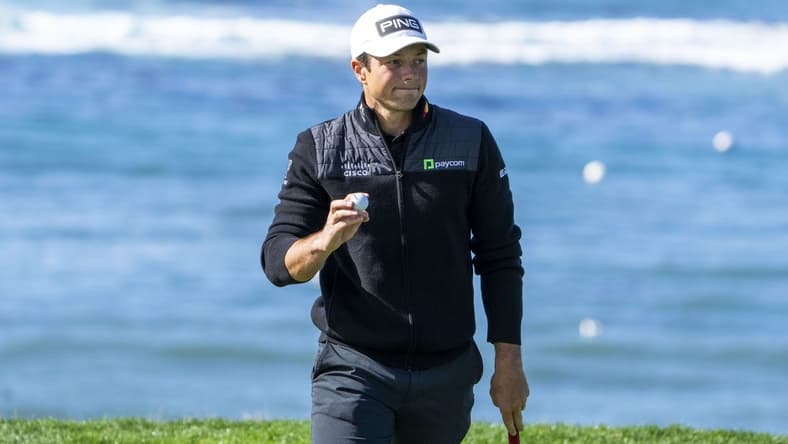 February 2, 2024; Pebble Beach, California, USA; Viktor Hovland acknowledges the crowd after making his putt on the fifth hole during the second round of the AT&T Pebble Beach Pro-Am golf tournament at Pebble Beach Golf Links. Mandatory Credit: Kyle Terada-USA TODAY Sports