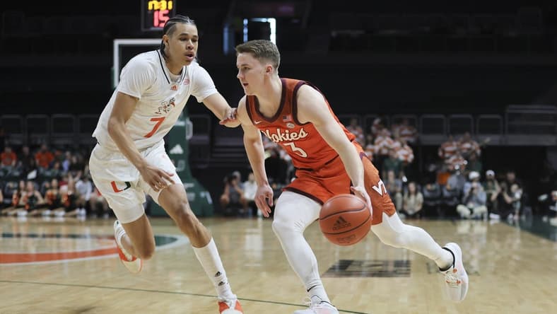 Feb 3, 2024; Coral Gables, Florida, USA; Virginia Tech Hokies guard Sean Pedulla (3) drives to the basket past Miami Hurricanes guard Kyshawn George (7) during the first half at Watsco Center. Mandatory Credit: Sam Navarro-USA TODAY Sports