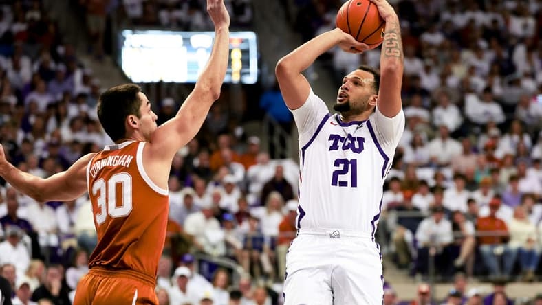 Feb 3, 2024; Fort Worth, Texas, USA;  TCU Horned Frogs forward JaKobe Coles (21) shoots over Texas Longhorns forward Brock Cunningham (30) during the first half at Ed and Rae Schollmaier Arena. Mandatory Credit: Kevin Jairaj-USA TODAY Sports