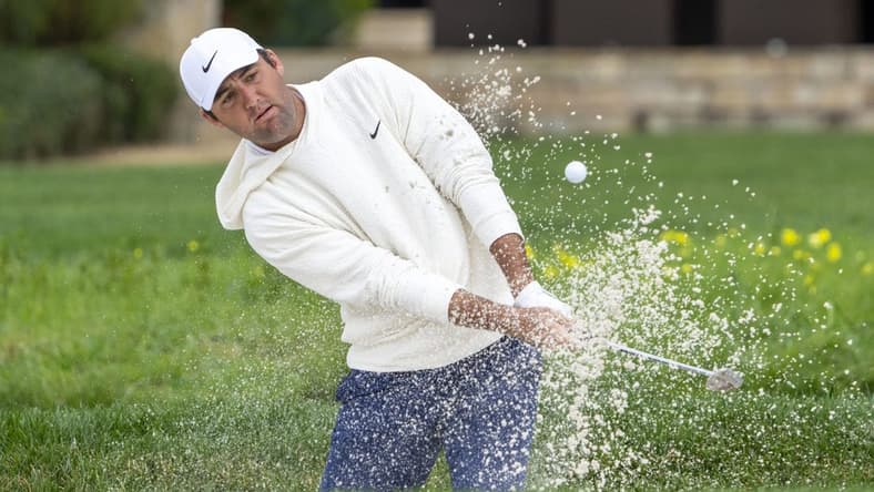 February 3, 2024; Pebble Beach, California, USA; Scottie Scheffler hits his bunker shot on the second hole during the third round of the AT&T Pebble Beach Pro-Am golf tournament at Pebble Beach Golf Links. Mandatory Credit: Kyle Terada-USA TODAY Sports