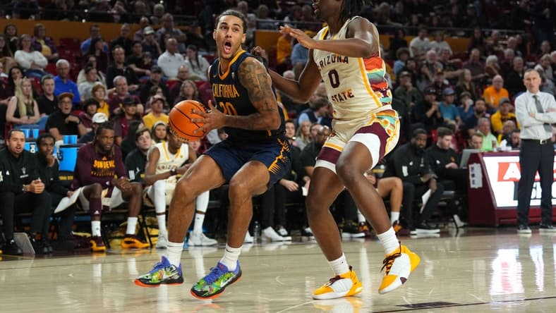 Feb 3, 2024; Tempe, Arizona, USA; California Golden Bears guard Jaylon Tyson (20) drives against Arizona State Sun Devils guard Kamari Lands (0) during the first half at Desert Financial Arena. Mandatory Credit: Joe Camporeale-USA TODAY Sports