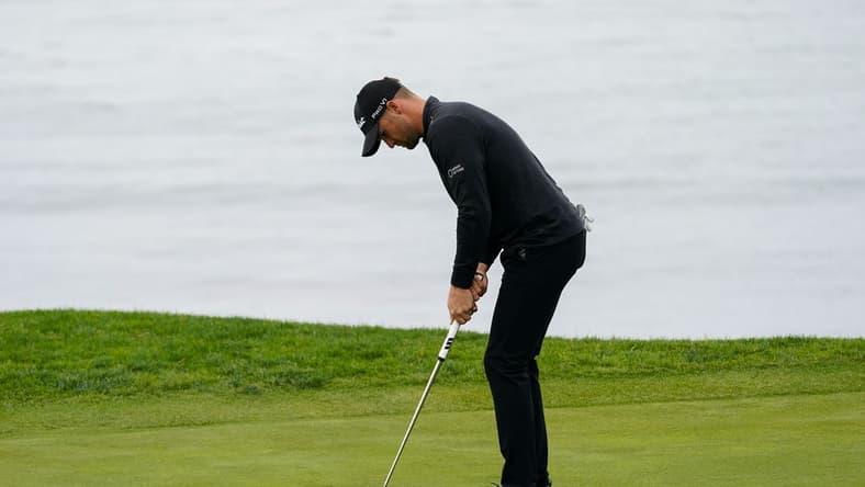 Feb 3, 2024; Pebble Beach, California, USA; Wyndham Clark putts on the fifth hole during the third round of the AT&T Pebble Beach Pro-Am golf tournament at Pebble Beach Golf Links. Mandatory Credit: Michael Madrid-USA TODAY Sports