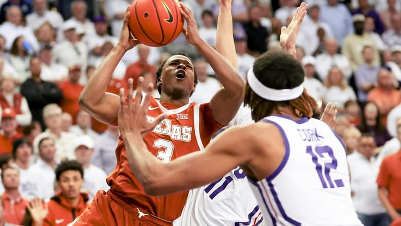 Feb 3, 2024; Fort Worth, Texas, USA;  Texas Longhorns guard Max Abmas (3) shoots as TCU Horned Frogs guard Trevian Tennyson (11) and TCU Horned Frogs forward Xavier Cork (12) defend during the second half at Ed and Rae Schollmaier Arena. Mandatory Credit: Kevin Jairaj-USA TODAY Sports