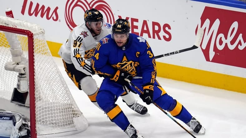 Feb 3, 2024; Toronto, Ontario, CAN; Team Matthews center Auston Matthews (34) of the Toronto Maple Leafs moves the puck against Team McDavid center Connor McDavid (97) of the Edmonton Oilers in the 2024 NHL All-Star Game at Scotiabank Arena. Mandatory Credit: John E. Sokolowski-USA TODAY Sports