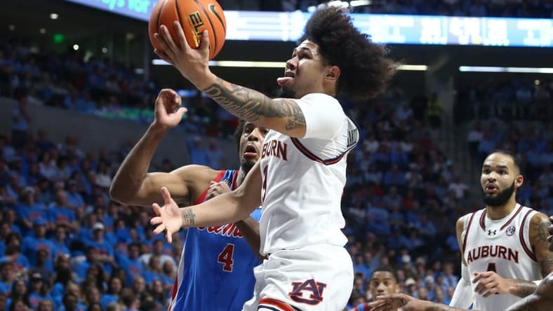 Feb 3, 2024; Oxford, Mississippi, USA; Auburn Tigers guard Tre Donaldson (3) drives to the basket during the first half against the Mississippi Rebels at The Sandy and John Black Pavilion at Ole Miss. Mandatory Credit: Petre Thomas-USA TODAY Sports