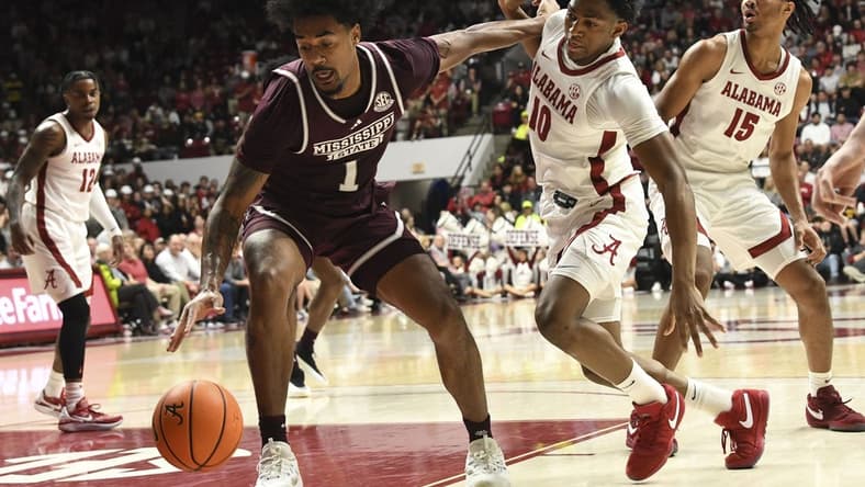 Feb 3, 2024; Tuscaloosa, Alabama, USA;  Mississippi State forward Tolu Smith III (1) pushes away Alabama forward Mouhamed Dioubate (10) as he makes a move to the basket at Coleman Coliseum. Mandatory Credit: Gary Cosby Jr.-USA TODAY Sports