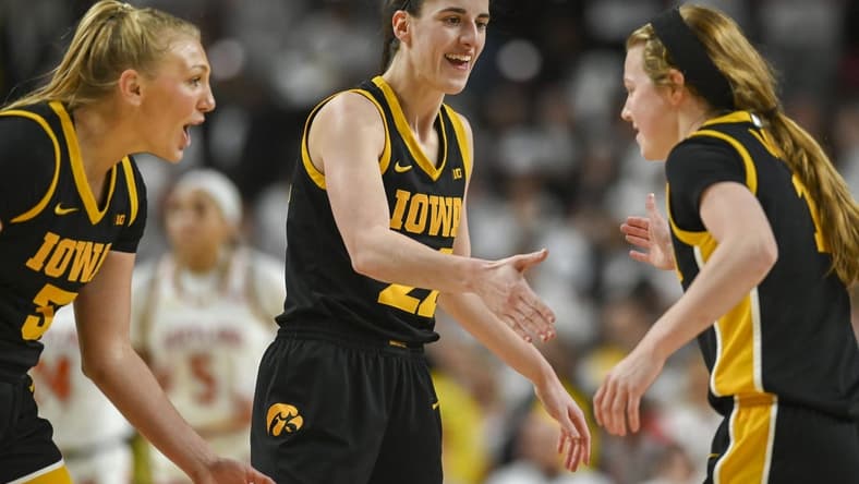 Feb 3, 2024; College Park, Maryland, USA; Iowa Hawkeyes guard Caitlin Clark (22) celebrates with guard Sydney Affolter (3) and guard Molly Davis (1) during the second half against the Maryland Terrapins at Xfinity Center. Mandatory Credit: Tommy Gilligan-USA TODAY Sports