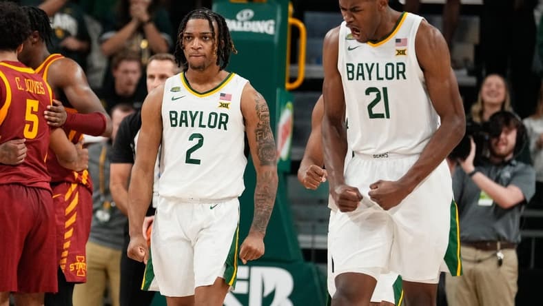 Feb 3, 2024; Waco, Texas, USA; Baylor Bears guard Jayden Nunn (2) and Baylor Bears center Yves Missi (21) reacts after Baylor Bears guard Jayden Nunn (2) scores and is fouled in the closing moments against the  Iowa State Cyclones at Paul and Alejandra Foster Pavilion. Mandatory Credit: Chris Jones-USA TODAY Sports
