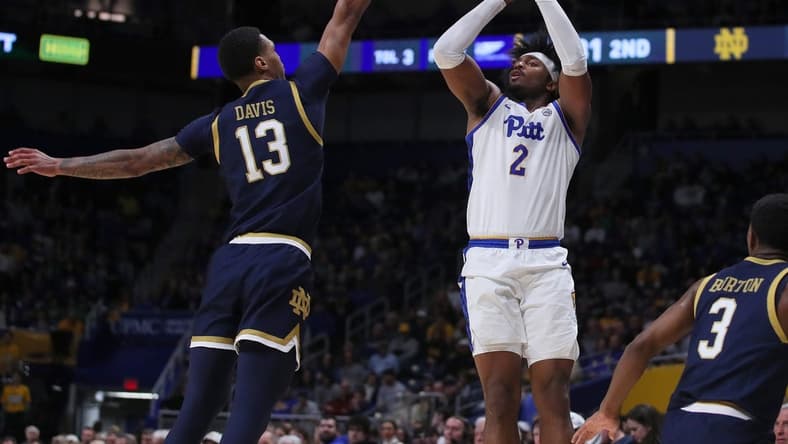 Pittsburgh Panthers Blake Hinson (2) attempts a three point shot over the head of Notre Dame Fighting Irish Tae Davis (13) during the second half on February 3, 2024 at the Petersen Events Center in Pittsburgh, PA.