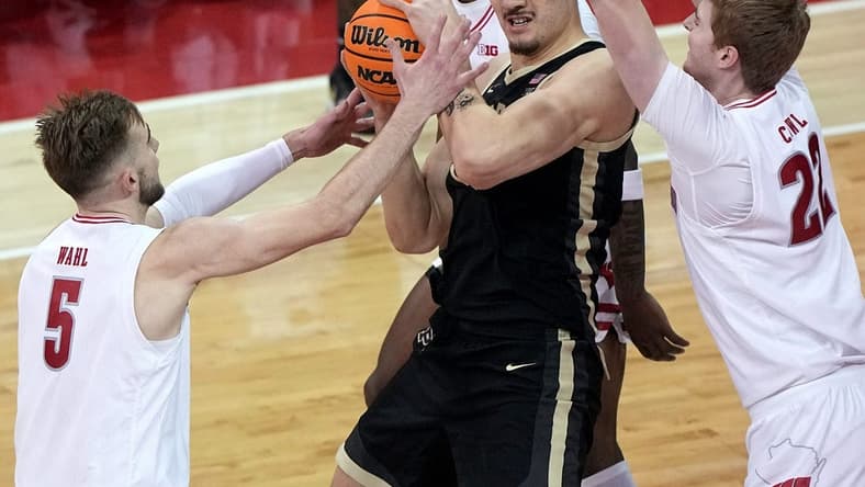 Purdue center Zach Edey is swamped by Wisconsin forwards Tyler Wahl (5) and Steven Crowl during the first half Sunday at the Kohl Center.Mark Hoffman/Milwaukee Journal Sentinel