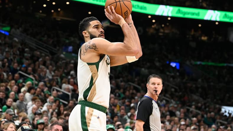 Feb 4, 2024; Boston, Massachusetts, USA; Boston Celtics forward Jayson Tatum (0)  shoots the ball against the Memphis Grizzlies during the first half at TD Garden. Mandatory Credit: Eric Canha-USA TODAY Sports