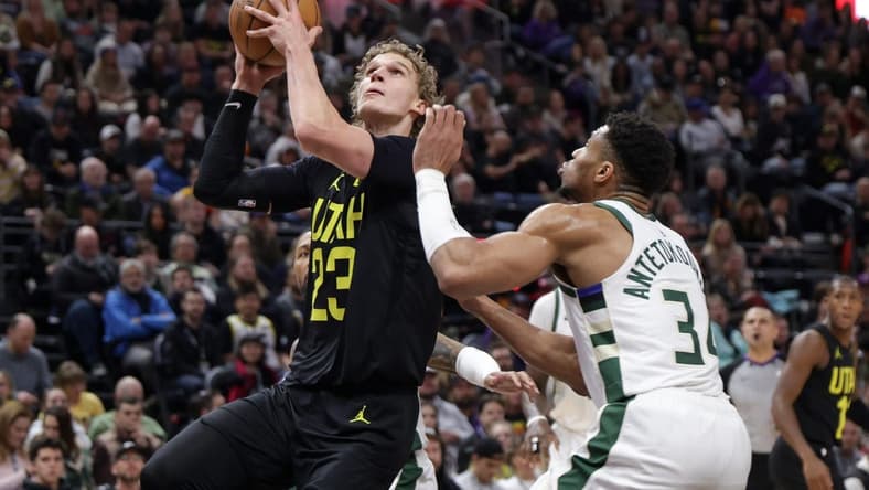 Feb 4, 2024; Salt Lake City, Utah, USA; Utah Jazz forward Lauri Markkanen (23) looks past Milwaukee Bucks forward Giannis Antetokounmpo (34) and to the basket during the second quarter at Delta Center. Mandatory Credit: Chris Nicoll-USA TODAY Sports