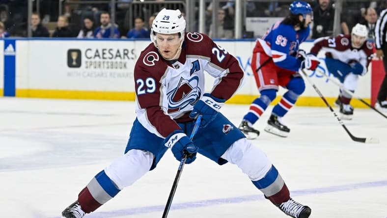 Feb 5, 2024; New York, New York, USA; Colorado Avalanche center Nathan MacKinnon (29) skates with the puck against the New York Rangers during the second period at Madison Square Garden. Mandatory Credit: Dennis Schneidler-USA TODAY Sports