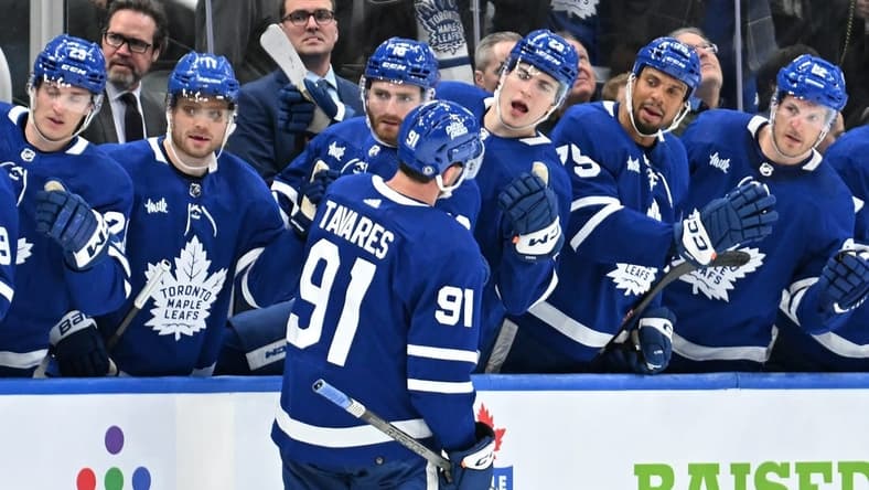 Feb 5, 2024; Toronto, Ontario, CAN;   Toronto Maple Leafs forward John Tavares (91) celebrates with team mates at the bench after scoring a goal against the New York Islanders in the third period at Scotiabank Arena. Mandatory Credit: Dan Hamilton-USA TODAY Sports