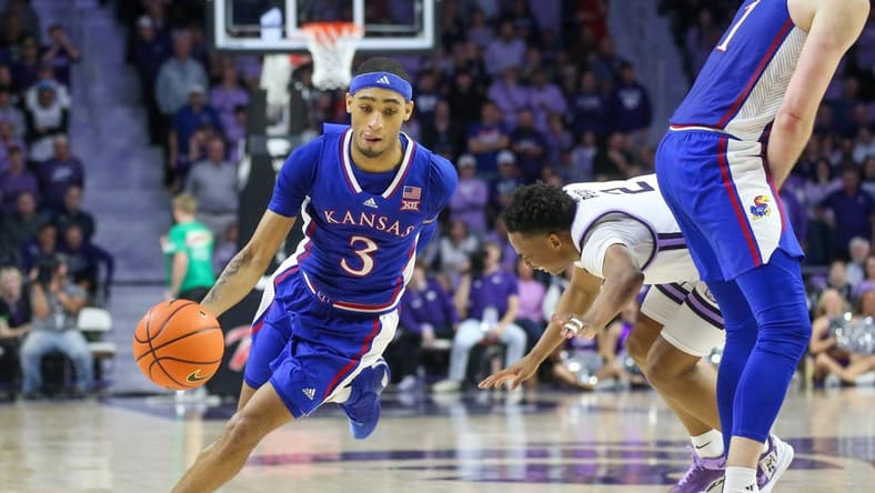 Feb 5, 2024; Manhattan, Kansas, USA; Kansas Jayhawks guard Dejuan Harris Jr. (3) dribbles around a pick on Kansas State Wildcats guard Tylor Perry (2) during the second half at Bramlage Coliseum. Mandatory Credit: Scott Sewell-USA TODAY Sports