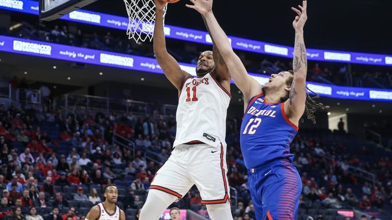 Feb 6, 2024; Elmont, New York, USA; St. John's Red Storm center Joel Soriano (11) and DePaul Blue Demons forward Mac Etienne (12) fight for a rebound in the first half at UBS Arena. Mandatory Credit: Wendell Cruz-USA TODAY Sports