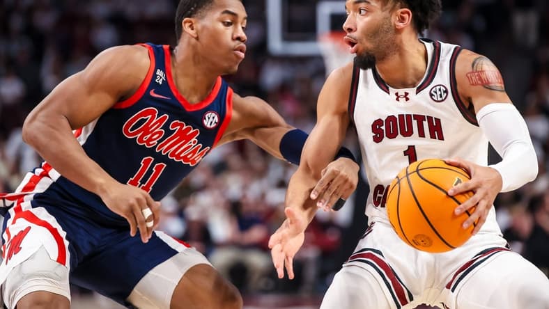 Feb 6, 2024; Columbia, South Carolina, USA; South Carolina Gamecocks guard Jacobi Wright (1) attempts to get around Mississippi Rebels guard Matthew Murrell (11) in the first half at Colonial Life Arena. Mandatory Credit: Jeff Blake-USA TODAY Sports