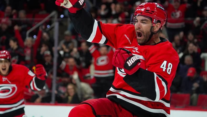 Feb 6, 2024; Raleigh, North Carolina, USA; Carolina Hurricanes left wing Jordan Martinook (48) celebrates his goal against the Vancouver Canucks during the first period at PNC Arena. Mandatory Credit: James Guillory-USA TODAY Sports