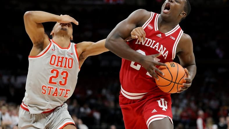 Feb 6, 2024; Columbus, Ohio, USA; Indiana Hoosiers forward Payton Sparks (24) controls the ball as Ohio State Buckeyes forward Zed Key (23) defends during the first half at Value City Arena. Mandatory Credit: Joseph Maiorana-USA TODAY Sports
