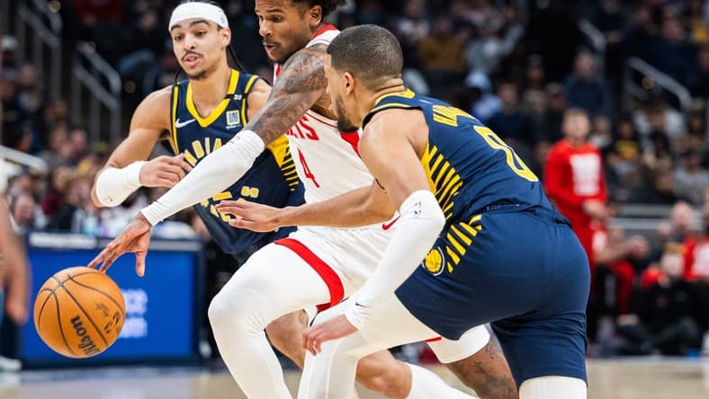 Feb 6, 2024; Indianapolis, Indiana, USA; Houston Rockets forward Amen Thompson (1) dribbles the ball while Indiana Pacers guard Tyrese Haliburton (0) defends in the first half at Gainbridge Fieldhouse. Mandatory Credit: Trevor Ruszkowski-USA TODAY Sports