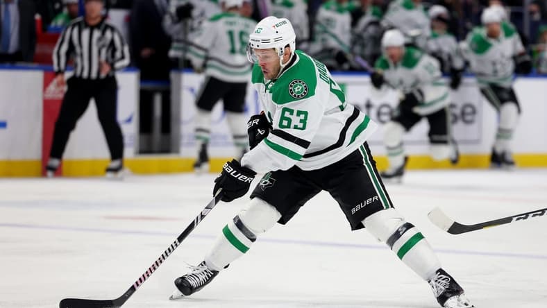 Feb 6, 2024; Buffalo, New York, USA; Dallas Stars right wing Evgenii Dadonov (63) skates with the puck during the third period against the Buffalo Sabres at KeyBank Center. Mandatory Credit: Timothy T. Ludwig-USA TODAY Sports