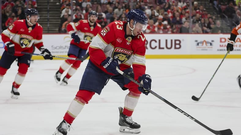 Feb 6, 2024; Sunrise, Florida, USA; Florida Panthers center Carter Verhaeghe (23) moves the puck against the Philadelphia Flyers during the third period at Amerant Bank Arena. Mandatory Credit: Sam Navarro-USA TODAY Sports