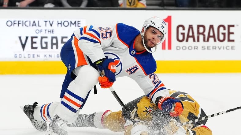Feb 6, 2024; Las Vegas, Nevada, USA; Edmonton Oilers defenseman Darnell Nurse (25) takes down Vegas Golden Knights center Paul Cotter (43) during the first period at T-Mobile Arena. Mandatory Credit: Stephen R. Sylvanie-USA TODAY Sports