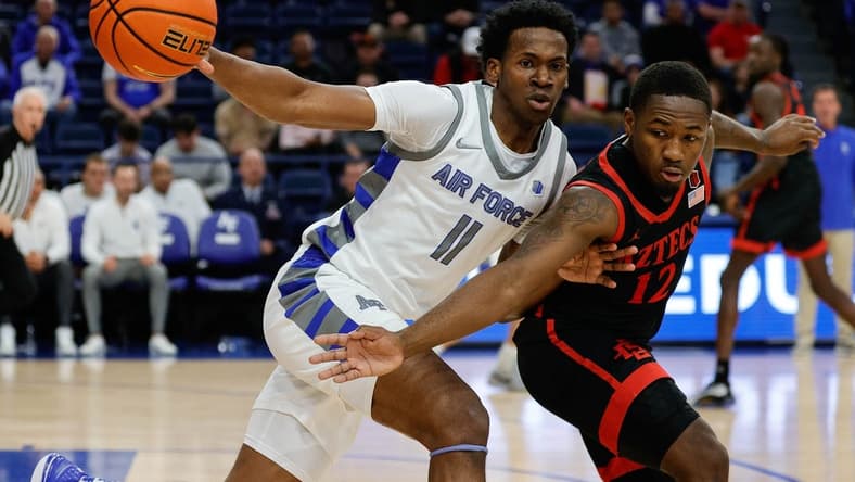 Feb 6, 2024; Colorado Springs, Colorado, USA; Air Force Falcons guard Byron Brown (11) and San Diego State Aztecs guard Darrion Trammell (12) battle for the ball in the first half at Clune Arena. Mandatory Credit: Isaiah J. Downing-USA TODAY Sports