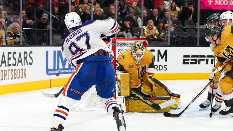 Feb 6, 2024; Las Vegas, Nevada, USA; Edmonton Oilers center Connor McDavid (97) hits the post behind Vegas Golden Knights goaltender Adin Hill (33) during the second period at T-Mobile Arena. Mandatory Credit: Stephen R. Sylvanie-USA TODAY Sports