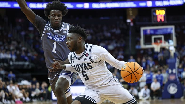 Feb 7, 2024; Newark, New Jersey, USA; Georgetown Hoyas guard Jay Heath (5) dribbles against Seton Hall Pirates guard Kadary Richmond (1) during the first half at Prudential Center. Mandatory Credit: Vincent Carchietta-USA TODAY Sports