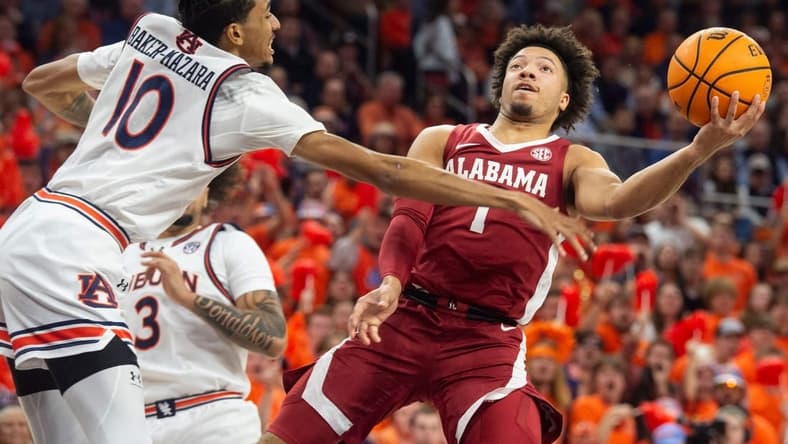 Alabama Crimson Tide guard Mark Sears (1) goes up for a layup as Auburn Tigers take on Alabama Crimson Tide at Neville Arena in Auburn, Ala., on Wednesday, Feb. 7, 2024.