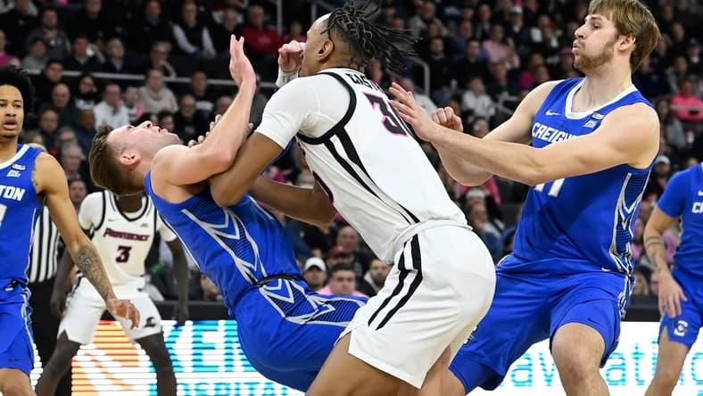 Feb 7, 2024; Providence, Rhode Island, USA; Creighton Bluejays guard Steven Ashworth (1)  is folded by Providence Friars forward Rafael Castro (30) during the first half at Amica Mutual Pavilion. Mandatory Credit: Eric Canha-USA TODAY Sports