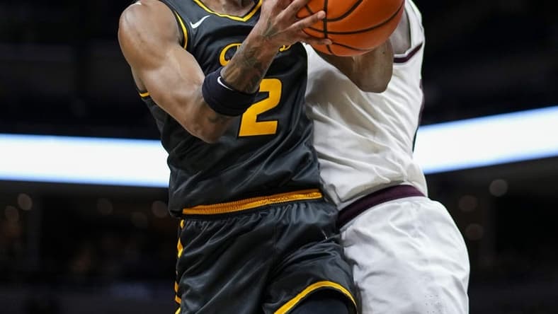 Feb 7, 2024; Columbia, Missouri, USA; Missouri Tigers guard Tamar Bates (2) goes up for a shot against Texas A&M Aggies forward Wildens Leveque (10) during the first half at Mizzou Arena. Mandatory Credit: Jay Biggerstaff-USA TODAY Sports