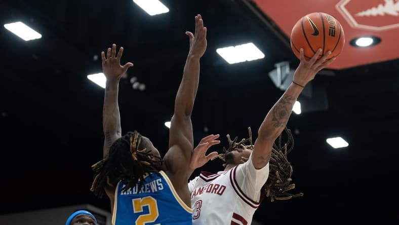 Feb 7, 2024; Stanford, California, USA; Stanford Cardinal guard Andrej Stojakovic (2) attempts to shoot over UCLA Bruins guard Dylan Andrews (2) during the first half at Maples Pavilion. Mandatory Credit: Stan Szeto-USA TODAY Sports