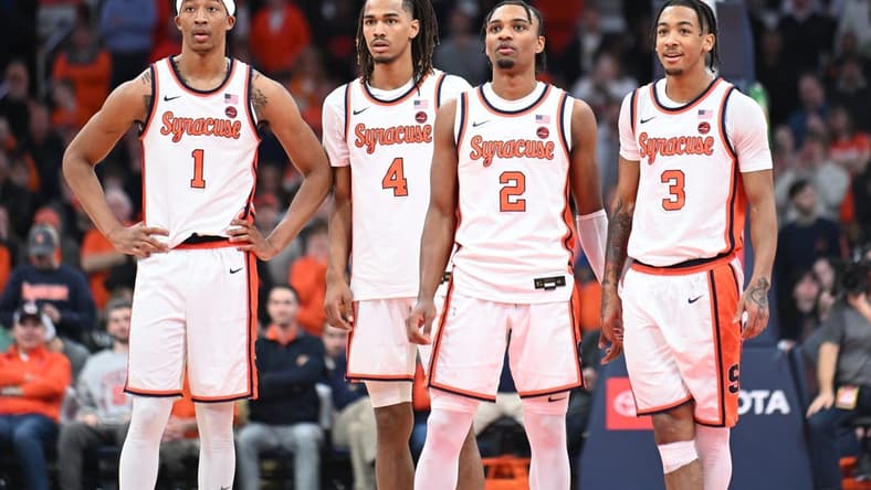 Feb 7, 2024; Syracuse, New York, USA; Syracuse Orange forward Maliq Brown (1) and forward Chris Bell (4) and guard JJ Starling (2) and guard Judah Mintz (3) watch a free throw down court in the second half against the Louisville Cardinals at the JMA Wireless Dome. Mandatory Credit: Mark Konezny-USA TODAY Sports