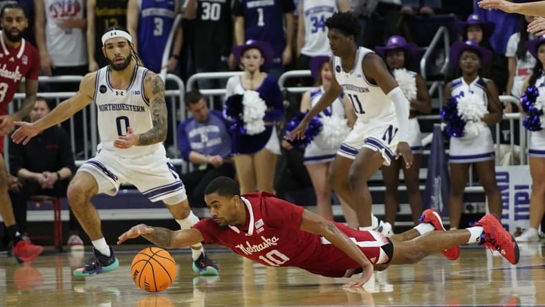 Feb 7, 2024; Evanston, Illinois, USA; Nebraska Cornhuskers guard Jamarques Lawrence (10) dives for a loose ball against the Northwestern Wildcats during the second half at Welsh-Ryan Arena. Mandatory Credit: David Banks-USA TODAY Sports