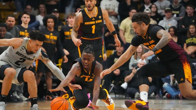 Feb 8, 2024; Boulder, Colorado, USA; Arizona State Sun Devils guard Kamari Lands (0) and guard Jose Perez (12) and Colorado Buffaloes guard KJ Simpson (2) reach for a loose ball in the first half at the CU Events Center. Mandatory Credit: Ron Chenoy-USA TODAY Sports
