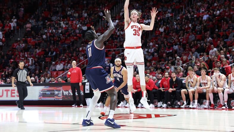 Feb 8, 2024; Salt Lake City, Utah, USA; Utah Utes center Branden Carlson (35) shoots over Arizona Wildcats center Oumar Ballo (11) during second overtime at Jon M. Huntsman Center. Mandatory Credit: Rob Gray-USA TODAY Sports