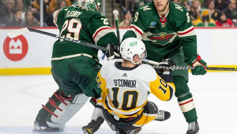 Feb 9, 2024; Saint Paul, Minnesota, USA; Minnesota Wild defenseman Dakota Mermis (6) is called for a penalty on Pittsburgh Penguins left wing Drew O'Connor (10) in the first period at Xcel Energy Center. Mandatory Credit: Matt Blewett-USA TODAY Sports