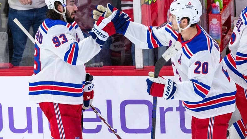 Feb 9, 2024; Chicago, Illinois, USA; New York Rangers center Mika Zibanejad (93) celebrates with center Rem Pitlick (20) against the Chicago Blackhawks after the game at the United Center. Mandatory Credit: Daniel Bartel-USA TODAY Sports