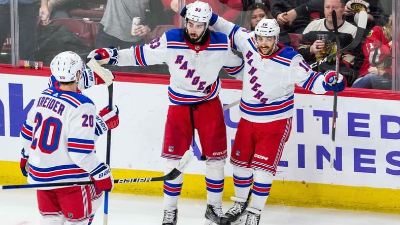Feb 9, 2024; Chicago, Illinois, USA; New York Rangers center Mika Zibanejad (93) celebrates his goal with teammates against the Chicago Blackhawks during overtime at the United Center. Mandatory Credit: Daniel Bartel-USA TODAY Sports