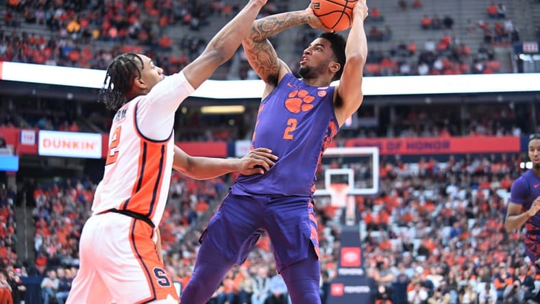 Feb 10, 2024; Syracuse, New York, USA; Clemson Tigers guard Dillon Hunter (2) shoots over Syracuse Orange guard JJ Starling in the first half at the JMA Wireless Dome. Mandatory Credit: Mark Konezny-USA TODAY Sports